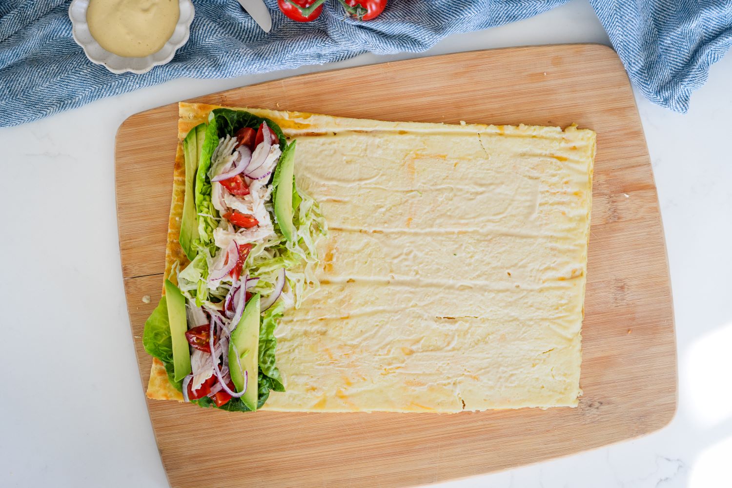 DMI_CottageCheeseWraps-6.jpg cottage cheese and egg flatbread filled with avocado, lettuce, red onion, tomato, and more.